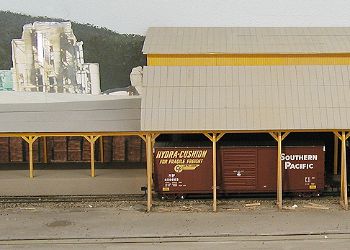 Box cars in loading shed