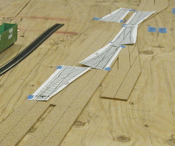 Cork for raising main line trackage