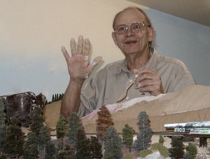 Art McKee plasters his logging scene